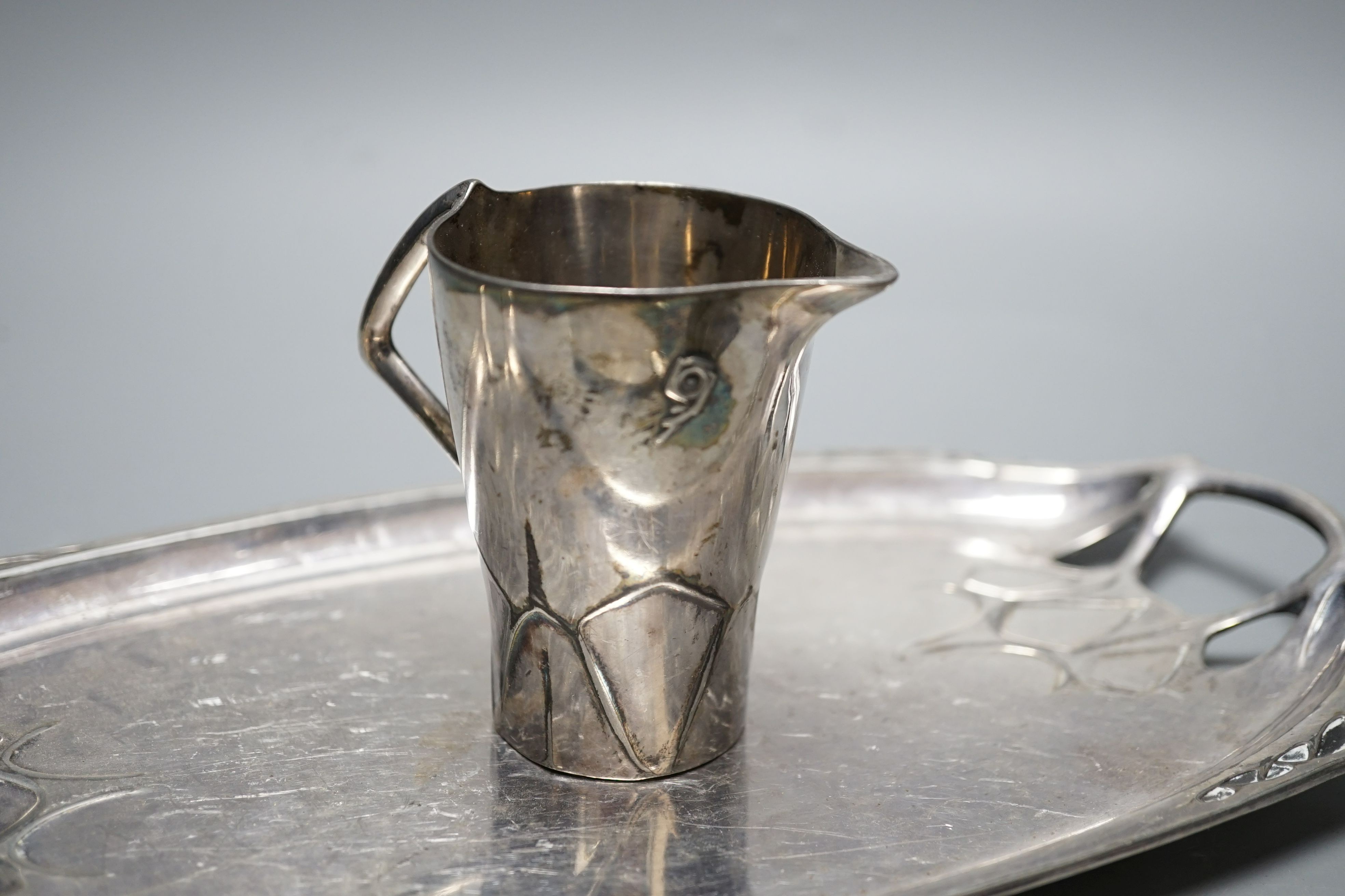 An Arts and Crafts Tudric pewter mug, stamped 534, a pair of WMF napkin rings together with other pewter and metal items, pewter mug 8cms high (9)